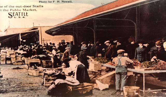 Stalls are added thanks to a $10,000 contribution from the City of Seattle. The Sanitary Market building opens as well.